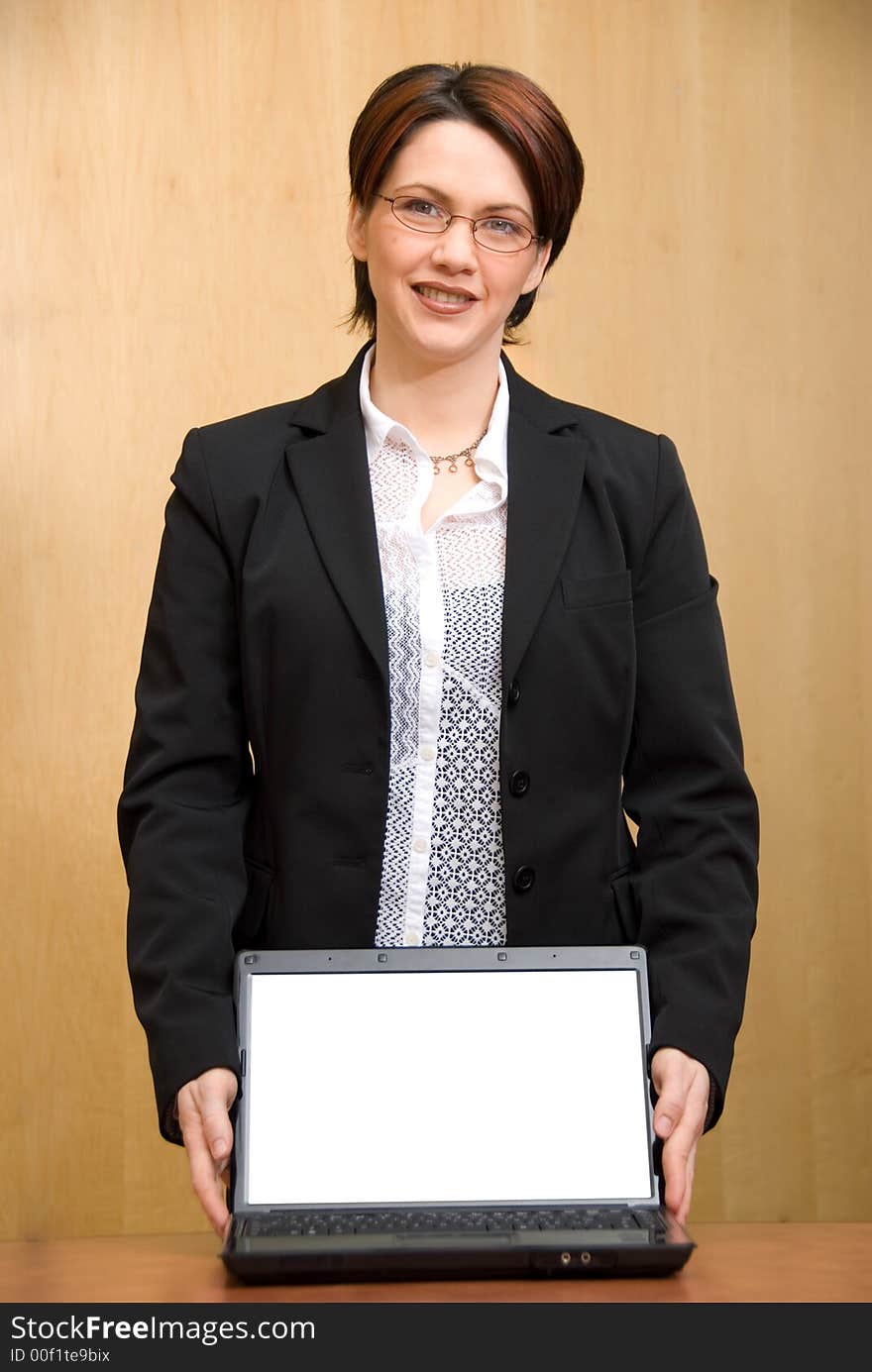 Happy business woman showing off her nice laptop. Happy business woman showing off her nice laptop