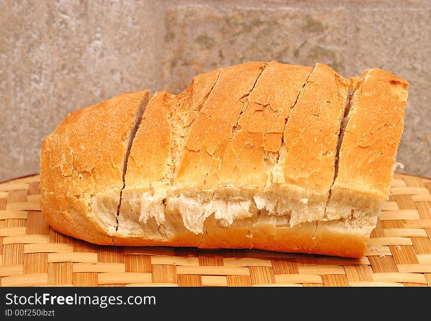 Slices of bread and stone wall in background