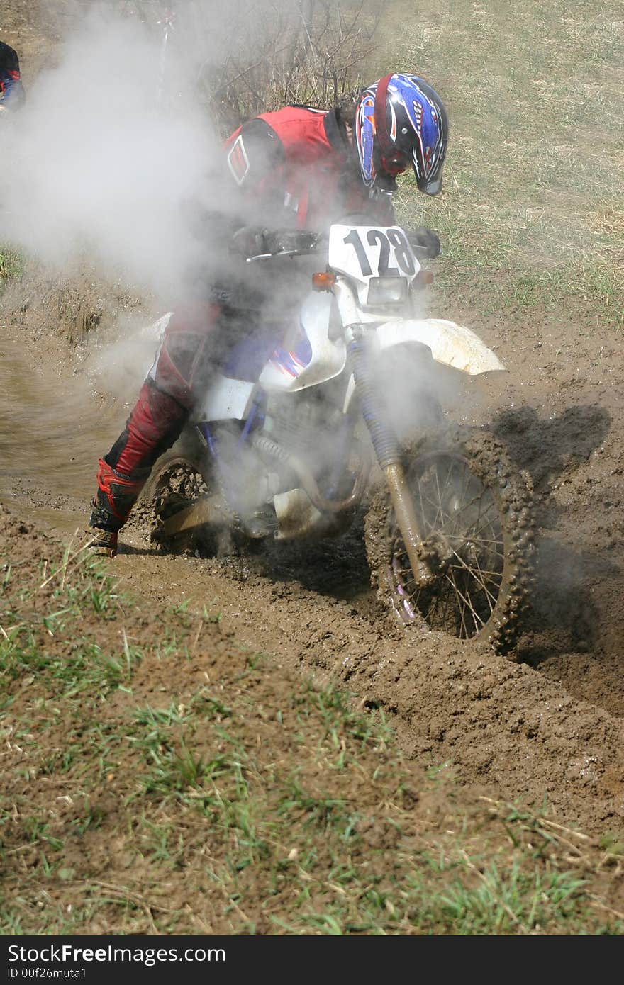 Motorcycle race on a cross-country terrain. Motorcycle race on a cross-country terrain.