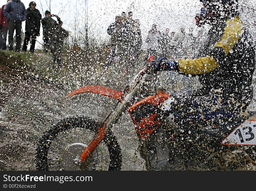 Motorcycle race on a cross-country terrain. Motorcycle race on a cross-country terrain.