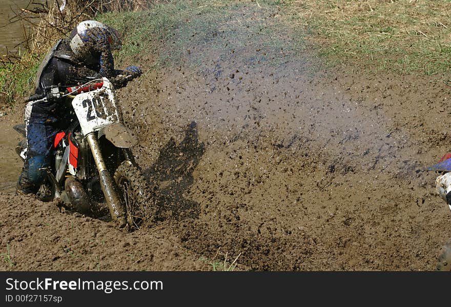 Motorcycle race on a cross-country terrain. Motorcycle race on a cross-country terrain.