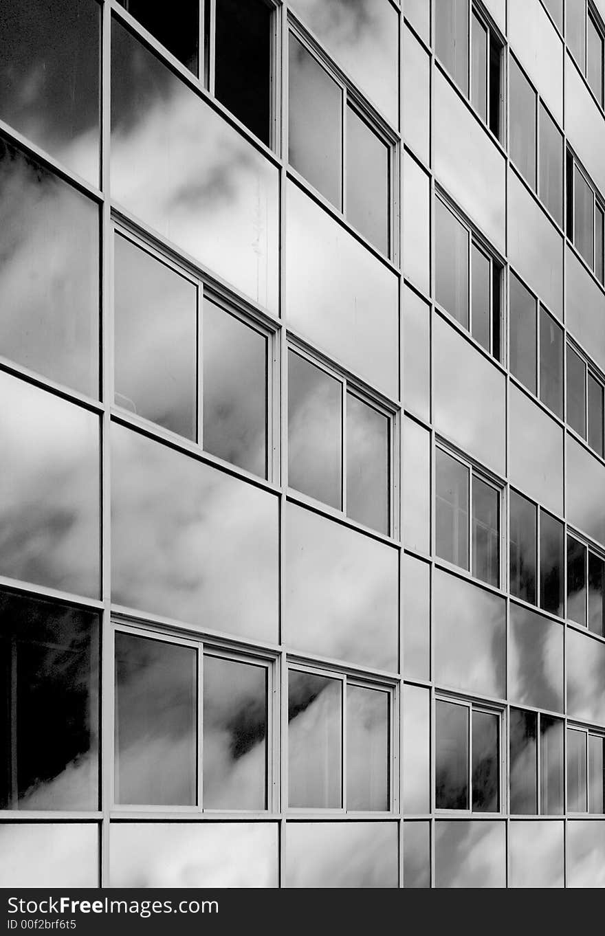 Reflection of clouds on the surface of a wall of an office building. Reflection of clouds on the surface of a wall of an office building