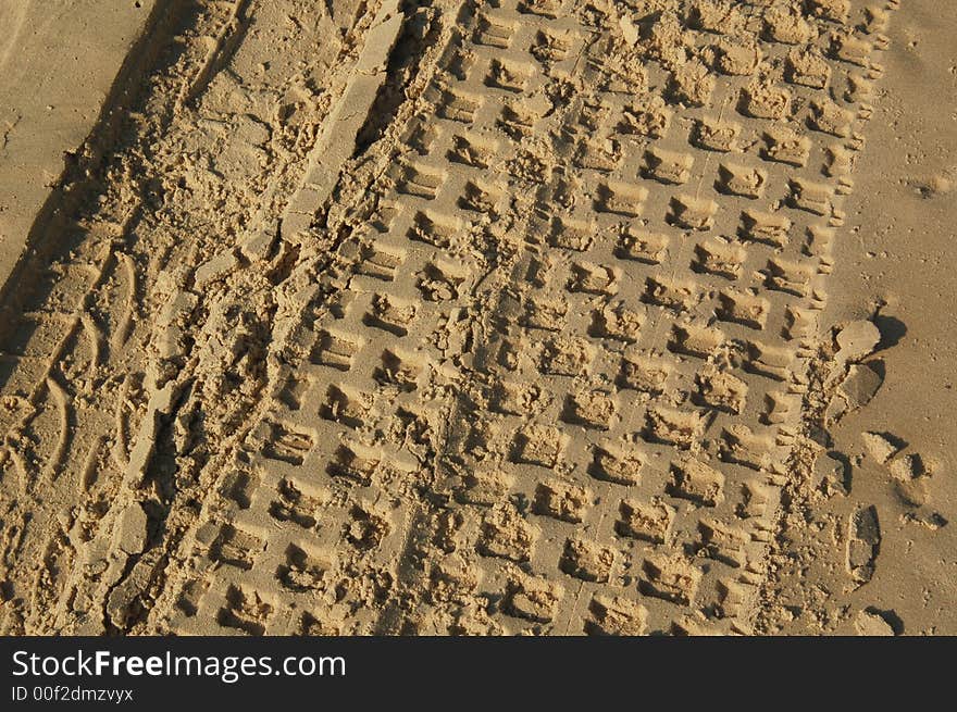 Path of car in sand