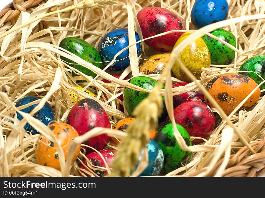 Easter eggs in straw nest. Easter eggs in straw nest