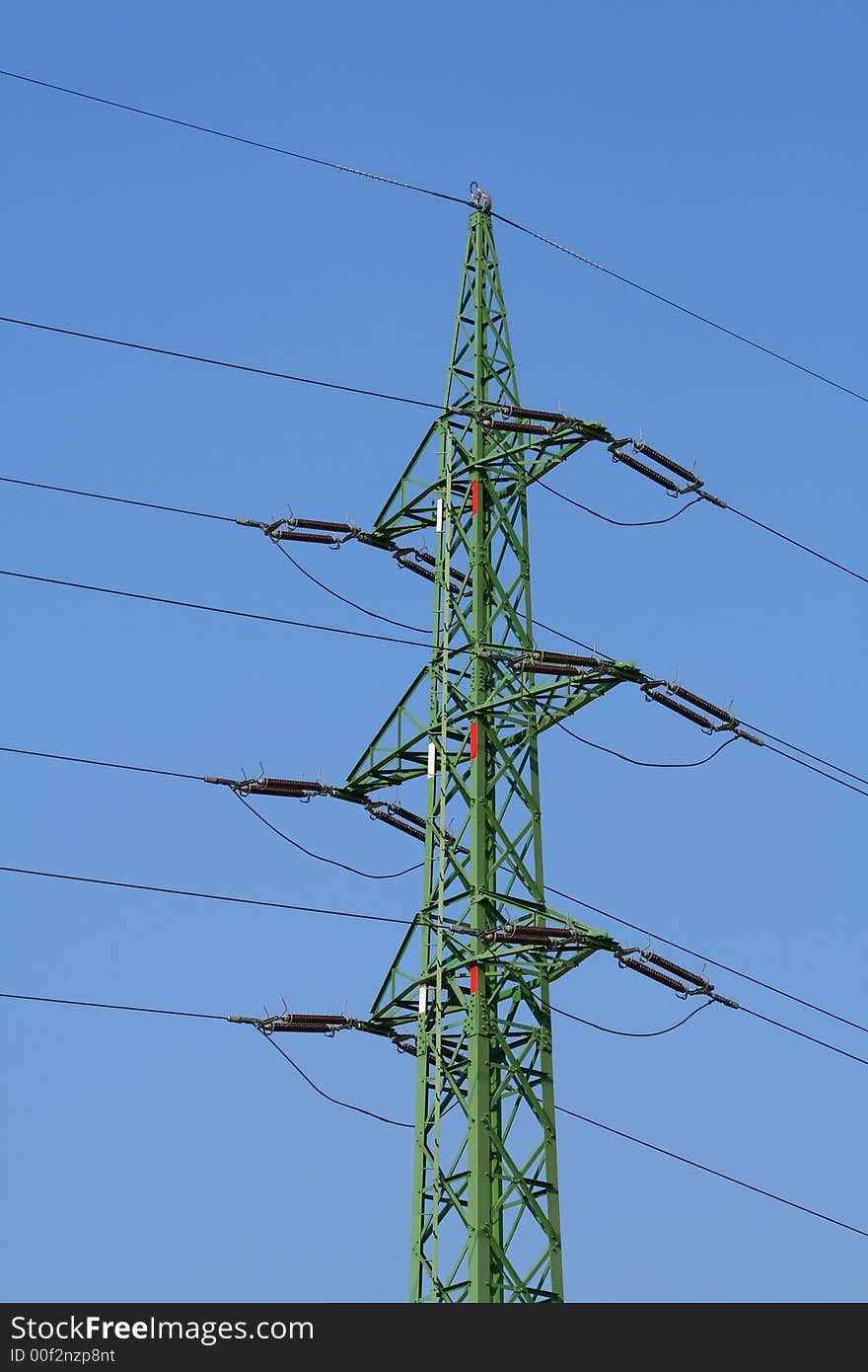 High Voltage Power lines against a blue sky. High Voltage Power lines against a blue sky