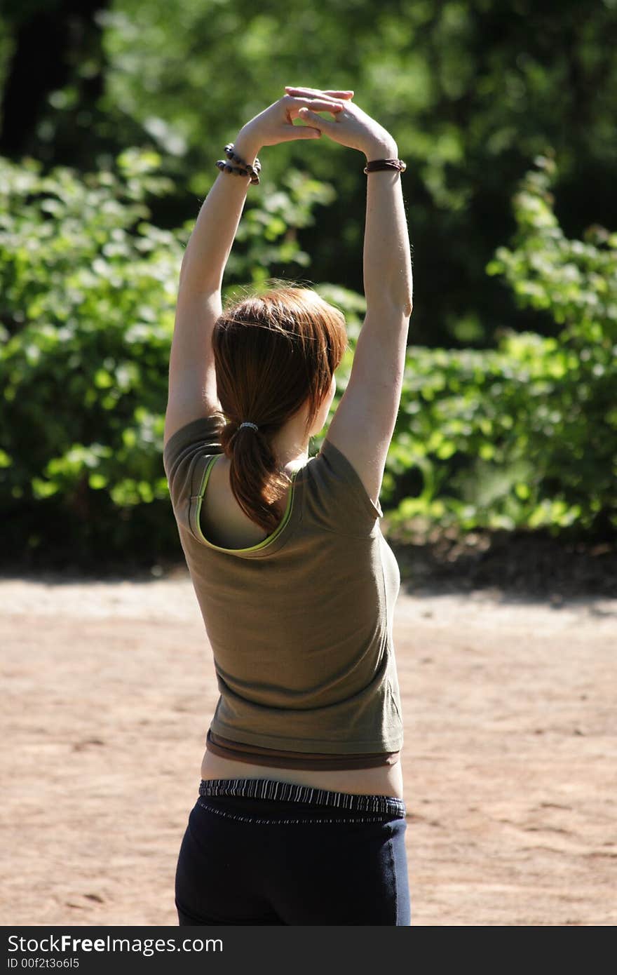 A woman practises thaj ti chuan in a park