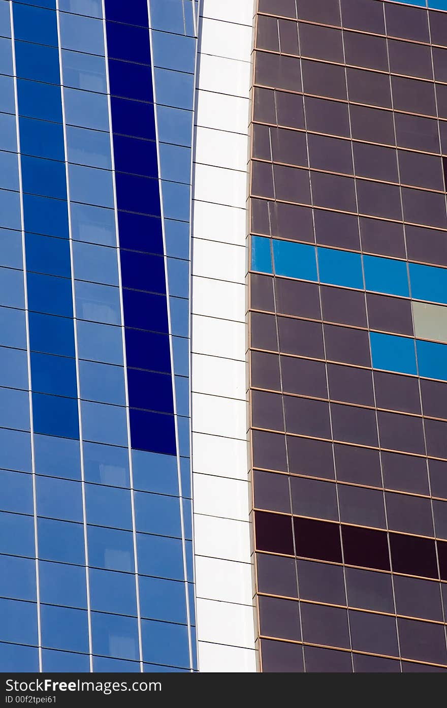 Building glass pattern showing square panels of glass in shades of blue and white