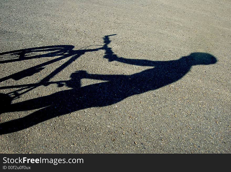 Photo of shadow of a biker. Photo of shadow of a biker.