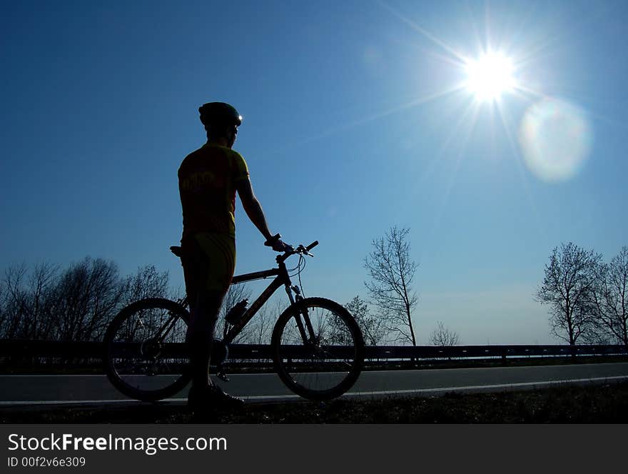 Photo of mountain biker silhouette. Photo of mountain biker silhouette.