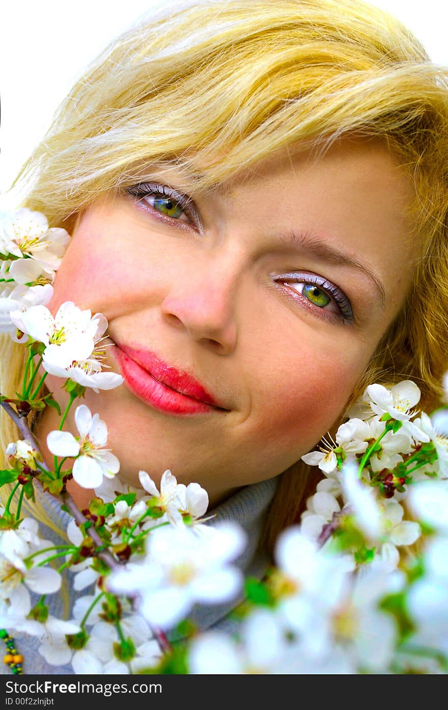 Beatiful girl among cherry flowers in bloom. Beatiful girl among cherry flowers in bloom