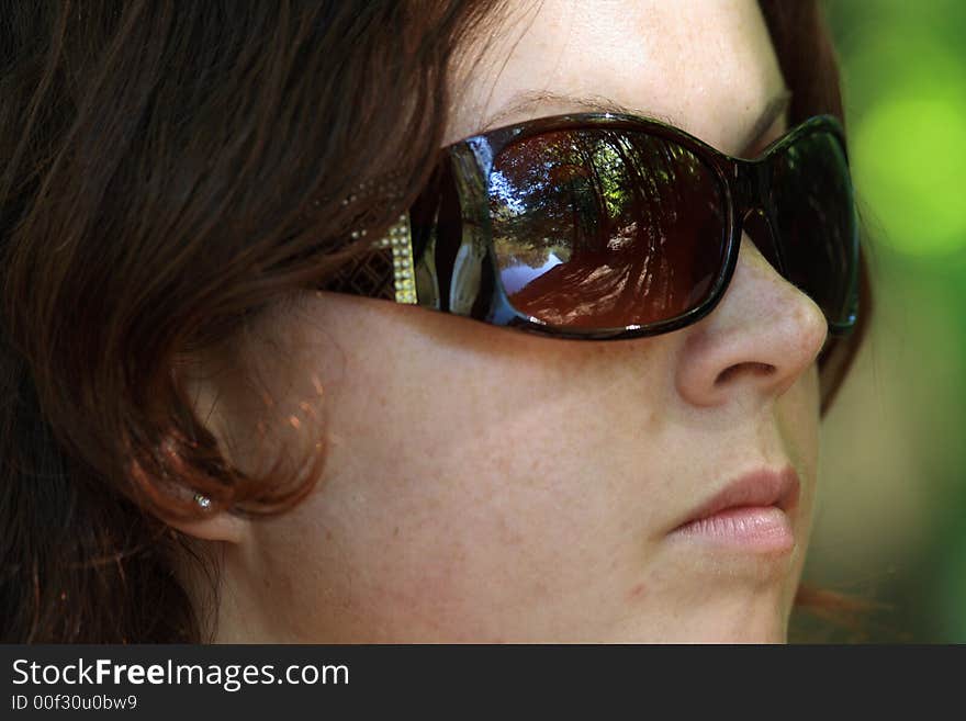 Portrait of a pretty woman with sun glasses