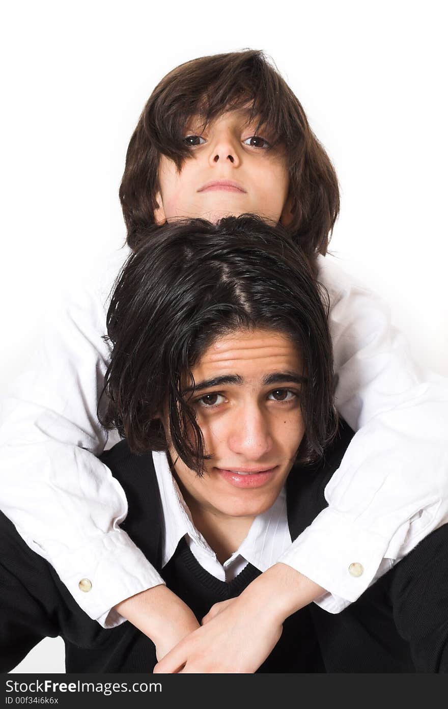 Brothers spending time and posing together over white background. Brothers spending time and posing together over white background