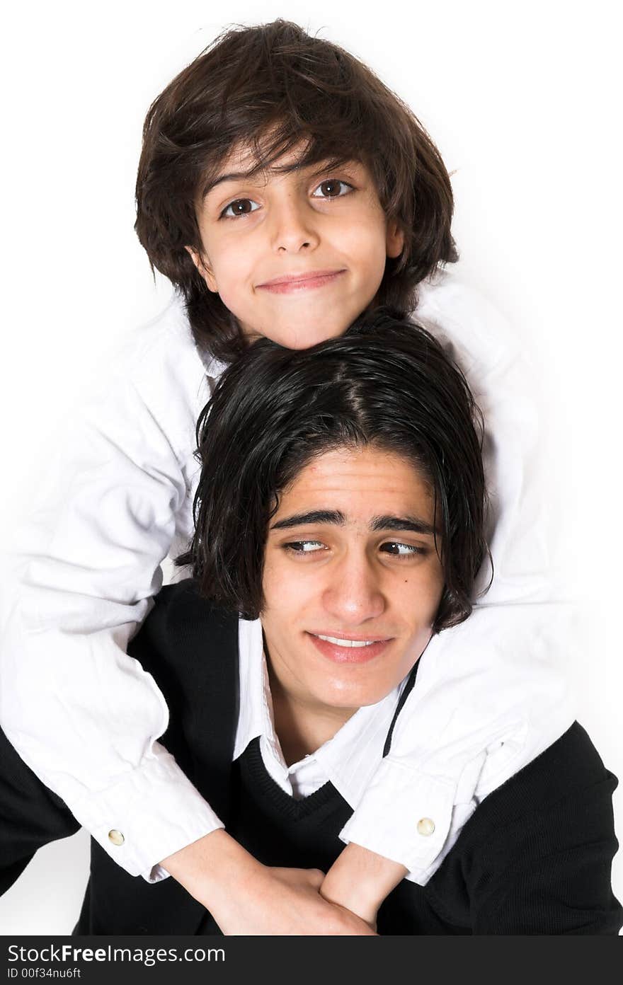 Brothers spending time and posing together over white background. Brothers spending time and posing together over white background