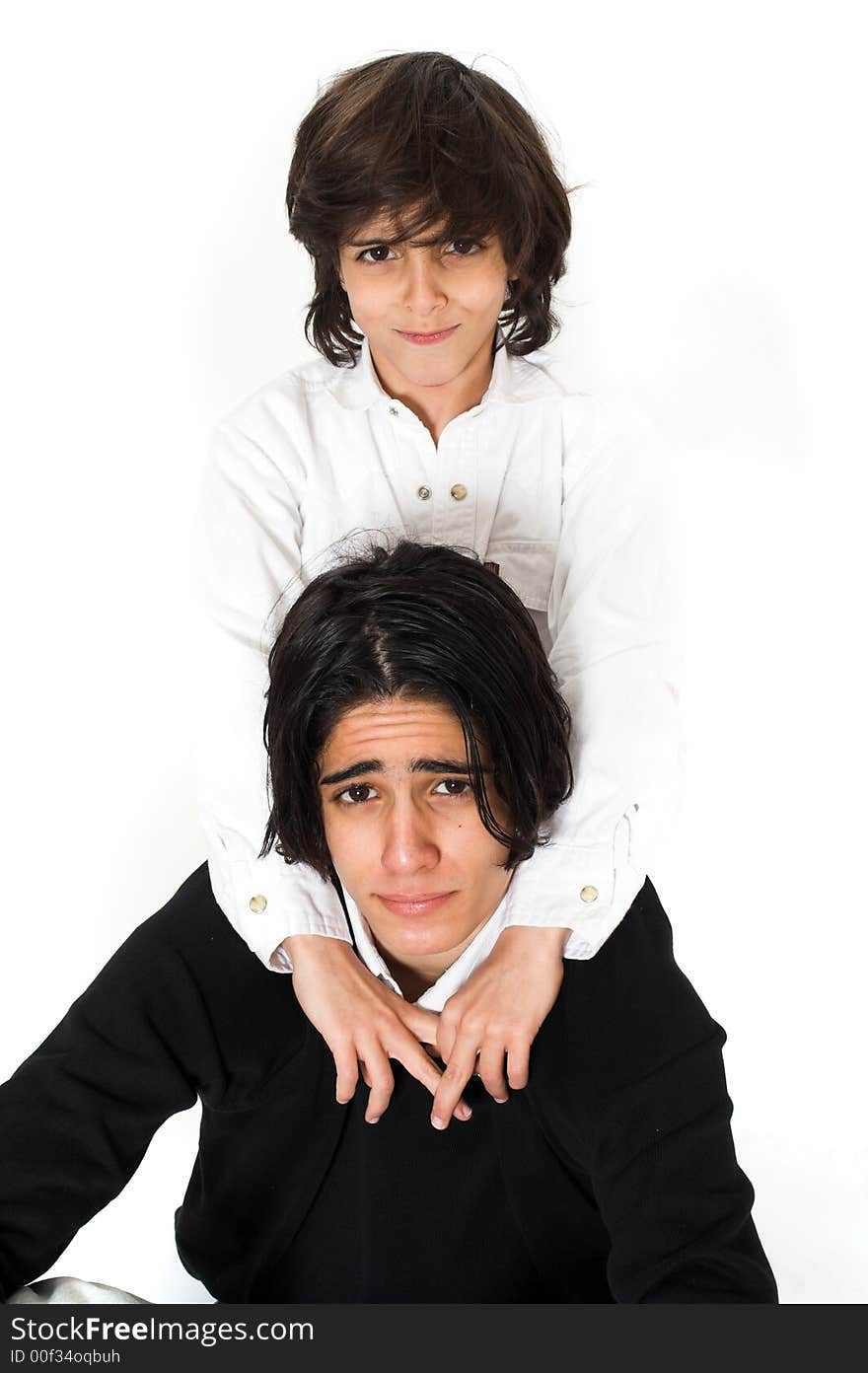 Brothers spending time and posing together over white background. Brothers spending time and posing together over white background