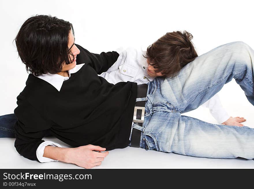 Brothers spending time and posing together over white background. Brothers spending time and posing together over white background