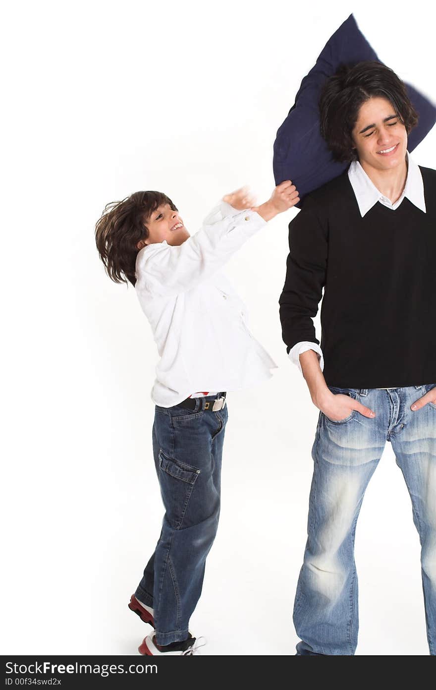 Brothers spending time and posing together over white background. Brothers spending time and posing together over white background