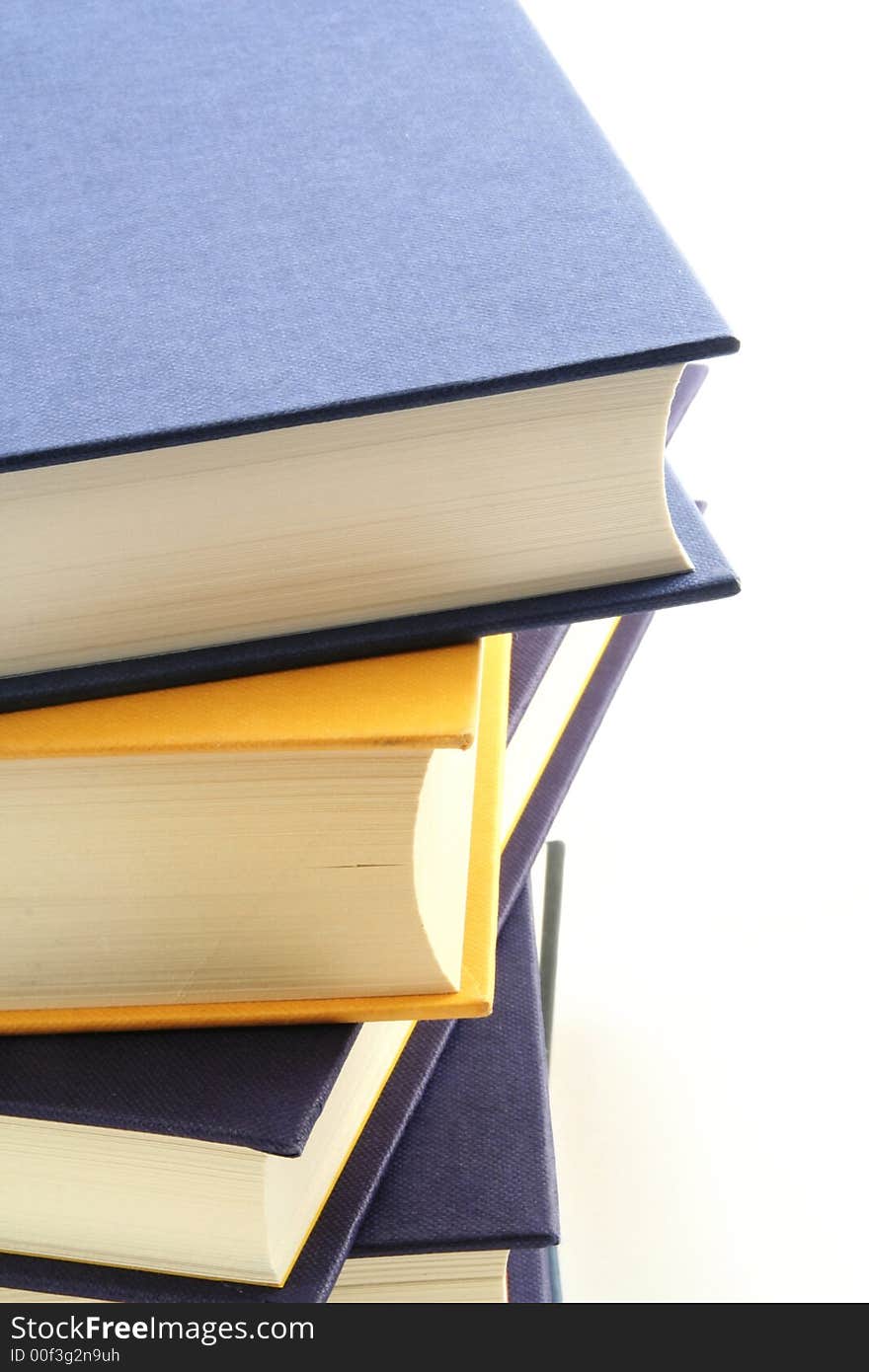 Stack of books against a white background