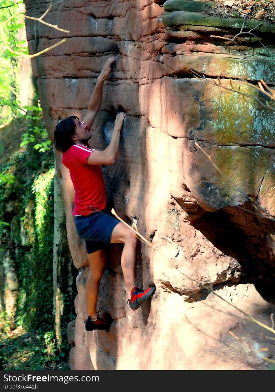 Climbing man. He wants up to the top without any security-rope. Very dangerous. The wall is 10 Meters high!. Climbing man. He wants up to the top without any security-rope. Very dangerous. The wall is 10 Meters high!