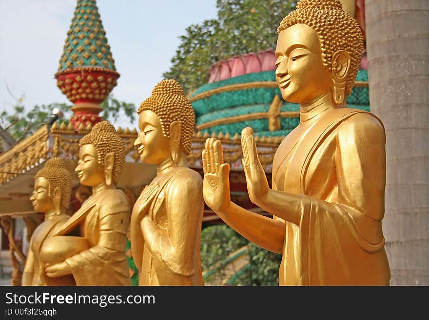 3 golden Buddhist statues with a narrow depth of field. 3 golden Buddhist statues with a narrow depth of field