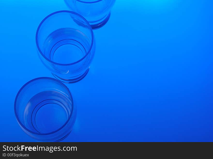 Liquid filled glasses with blue backlighting. Liquid filled glasses with blue backlighting.