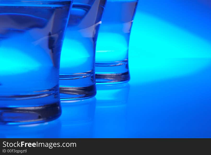 Liquid filled glasses with blue backlighting. Liquid filled glasses with blue backlighting.