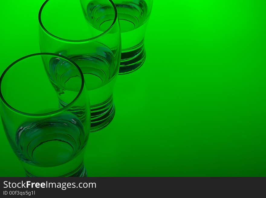 Liquid filled glasses with green back lighting. Liquid filled glasses with green back lighting.