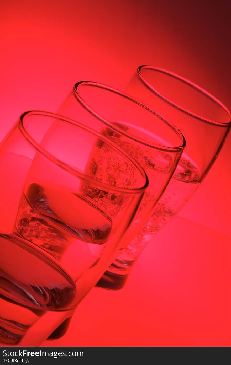 Liquid filled glasses with magenta backlighting. Liquid filled glasses with magenta backlighting.