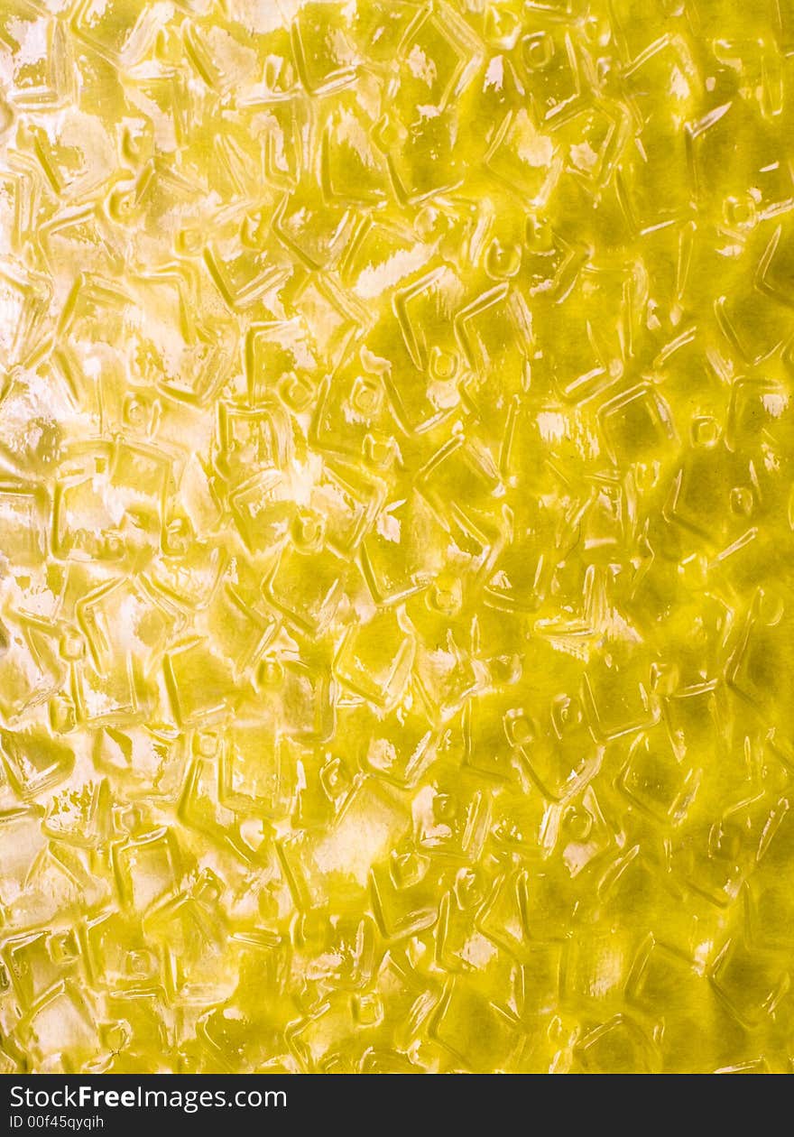 Texture of yellow glass. interesting light.