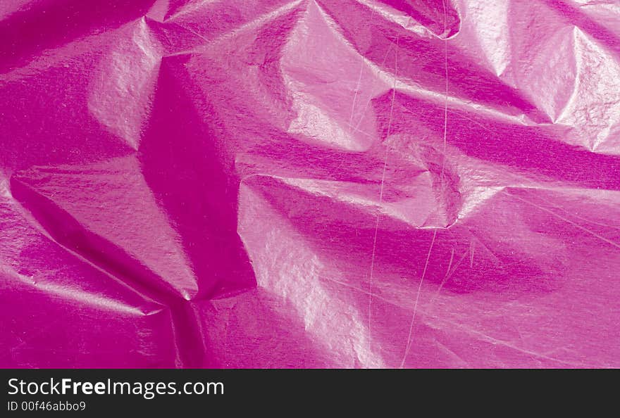 Pink crushed background. torn paper.