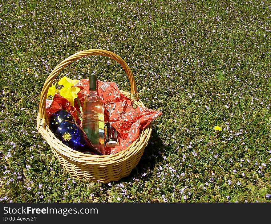 Bottle of wine in a picnic basket. Bottle of wine in a picnic basket