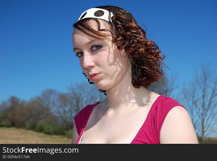 Teen girl playing around in a field. Teen girl playing around in a field