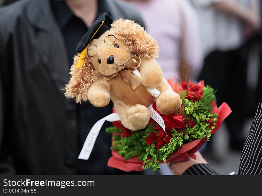 Graduation gift - a toy with red flowers. Graduation gift - a toy with red flowers