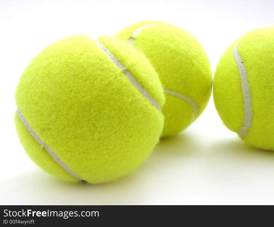 Three tennis balls on white. Three tennis balls on white