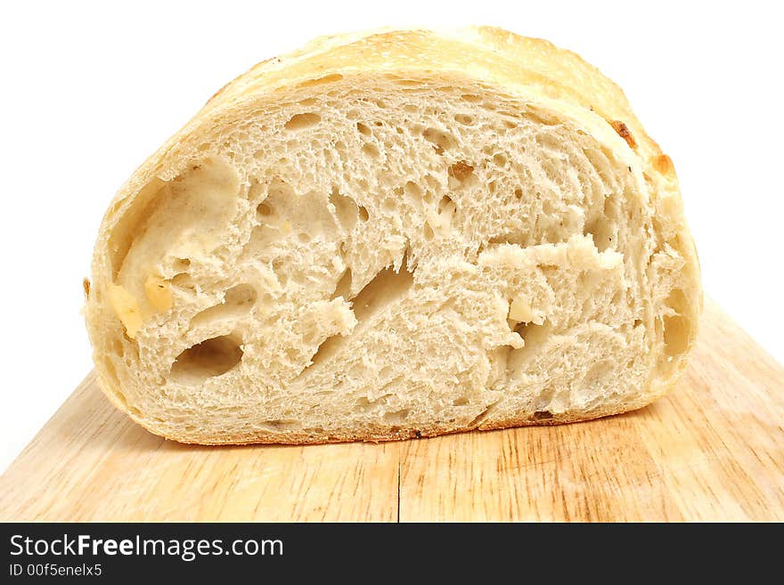 Isolated photo of homemade bread on white cutting board