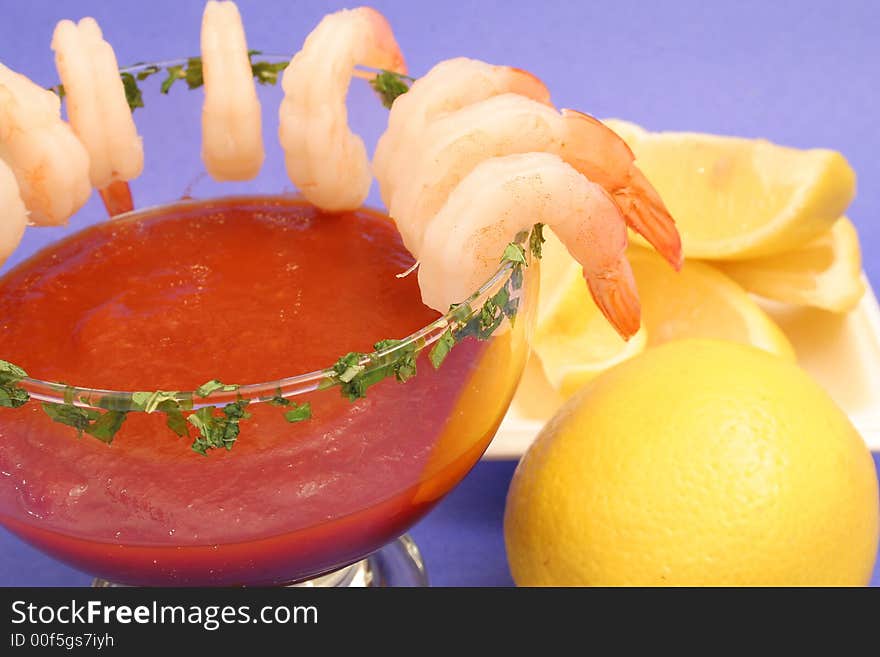 Shrimp cocktail on blue