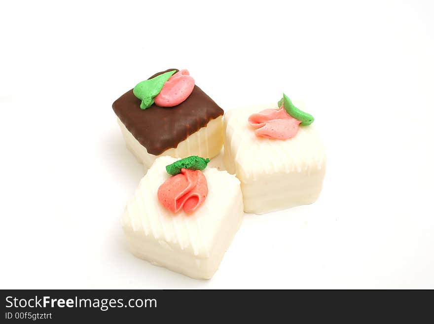 Isolated photo of a trio of cupcakes on white