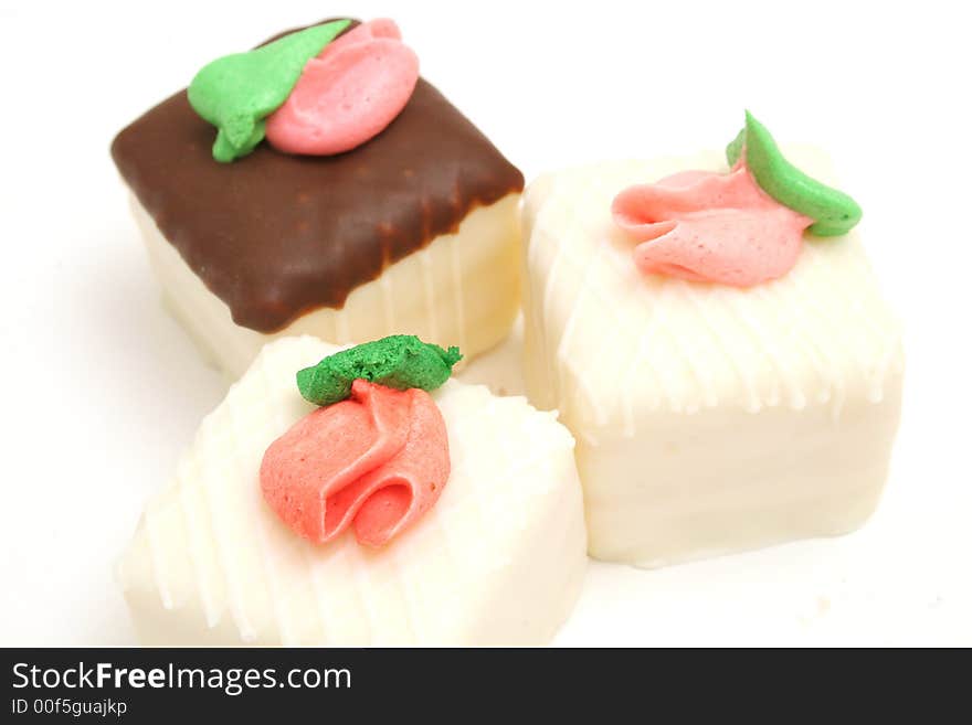 Isolated photo of a trio of cupcakes upclose on white