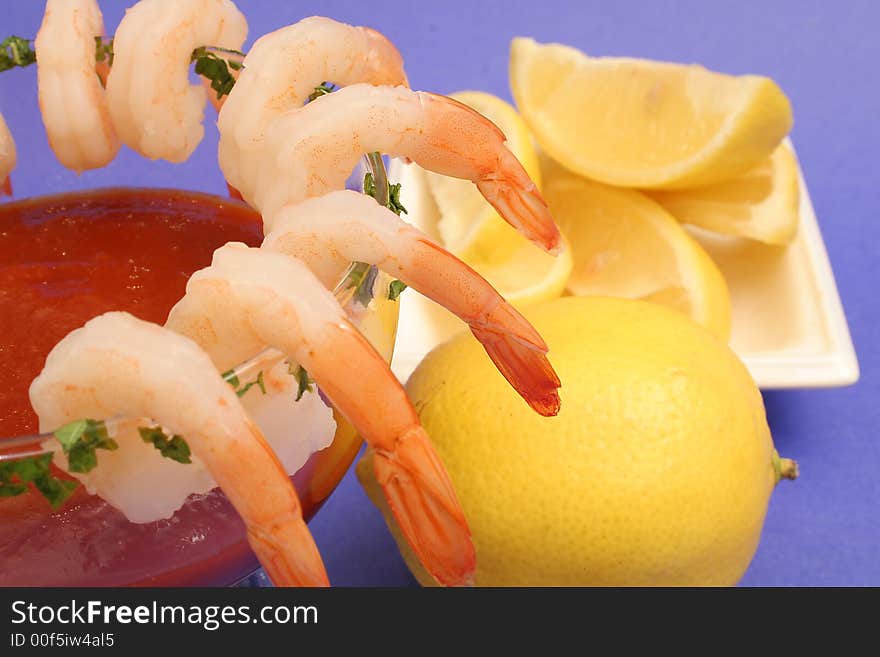 Shrimp cocktail with lemons