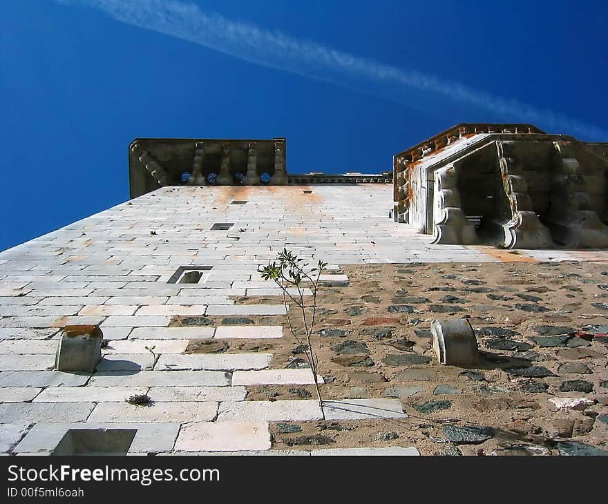 Looking up on the tower of the Beja Castle, Portugal. A difficult and hard climb free of obstacles but with challenging height.