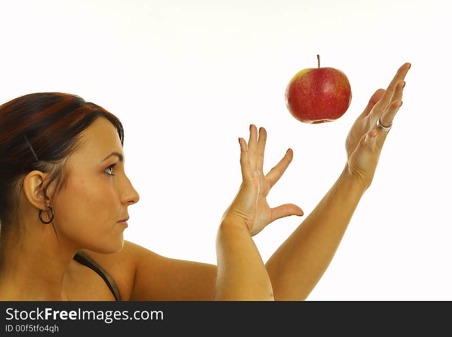 Healthy girl eating apples over a white background. Healthy girl eating apples over a white background