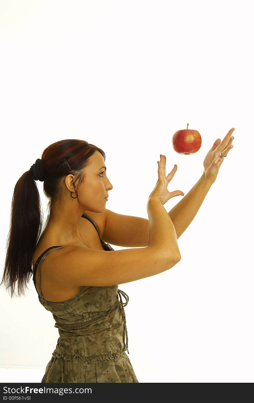 Healthy girl eating apples over a white background. Healthy girl eating apples over a white background