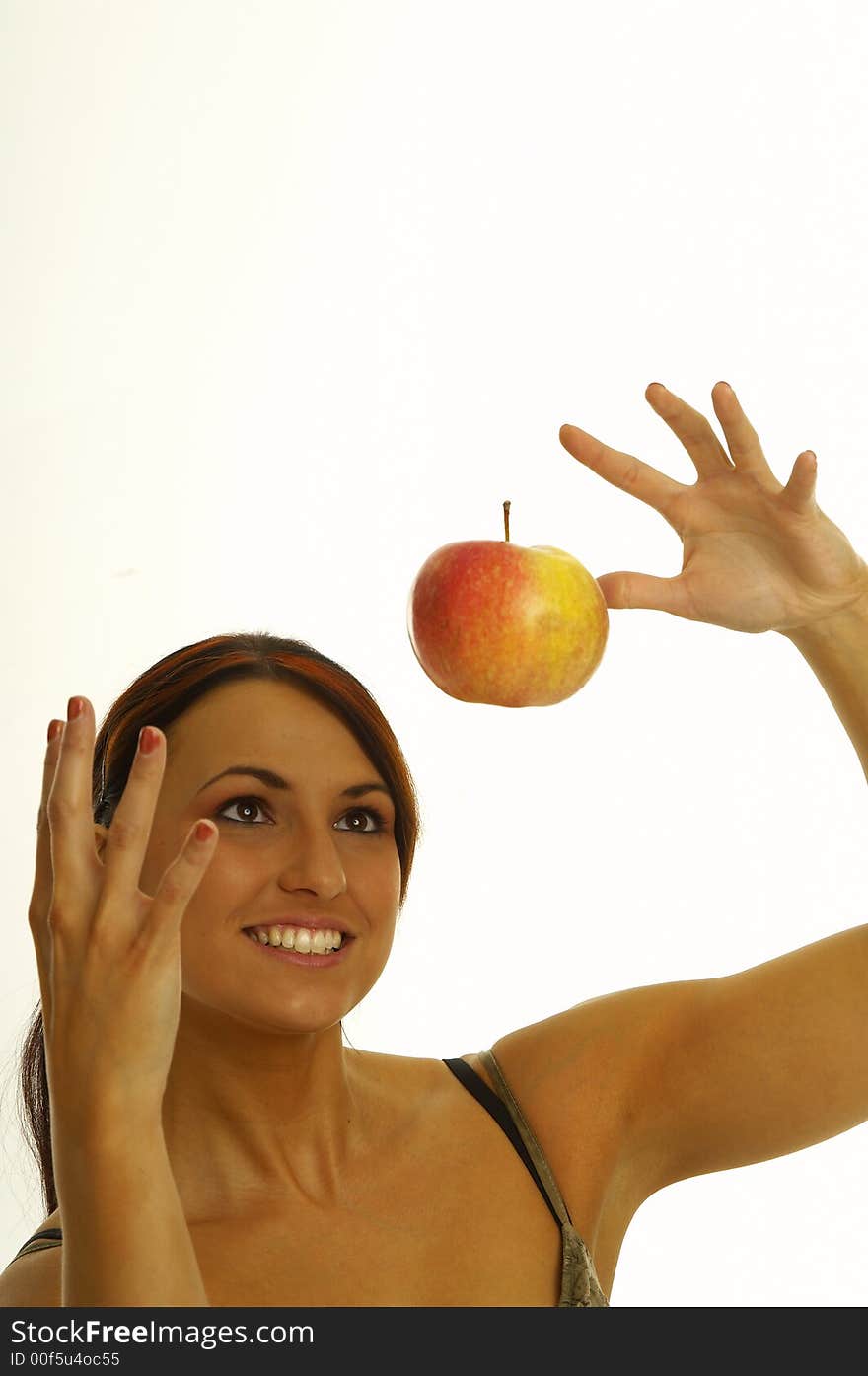 Healthy girl eating apples over a white background. Healthy girl eating apples over a white background