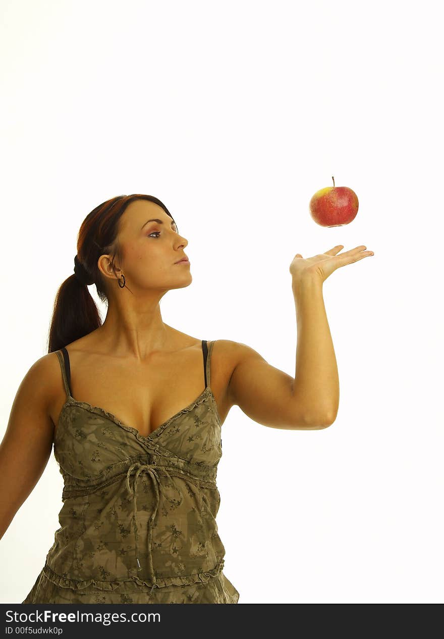 Healthy girl eating apples over a white background. Healthy girl eating apples over a white background