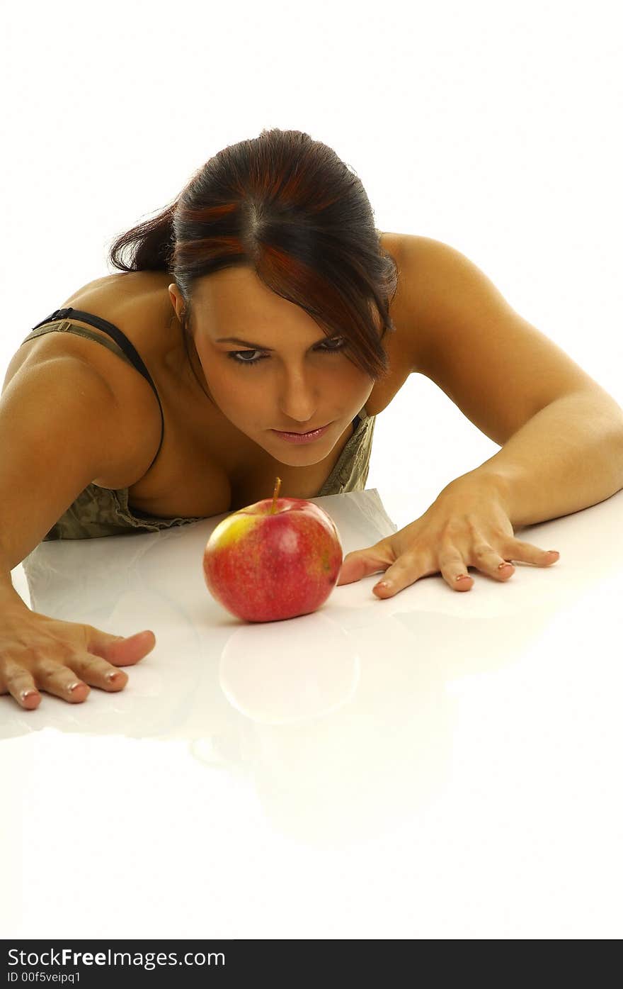 Healthy girl and apples over a white background