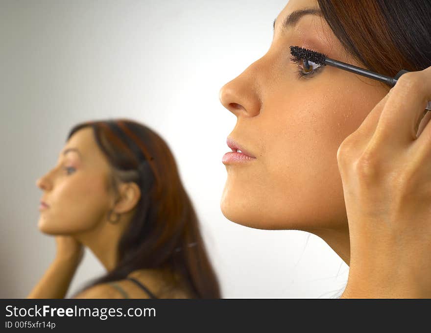 Beautiful Girl Applies Makeup