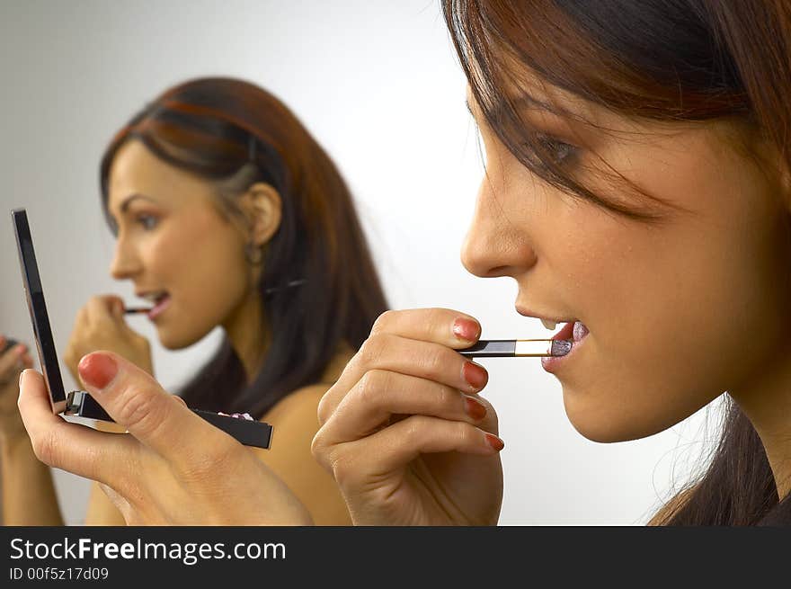 Beautiful Girl Applies Makeup