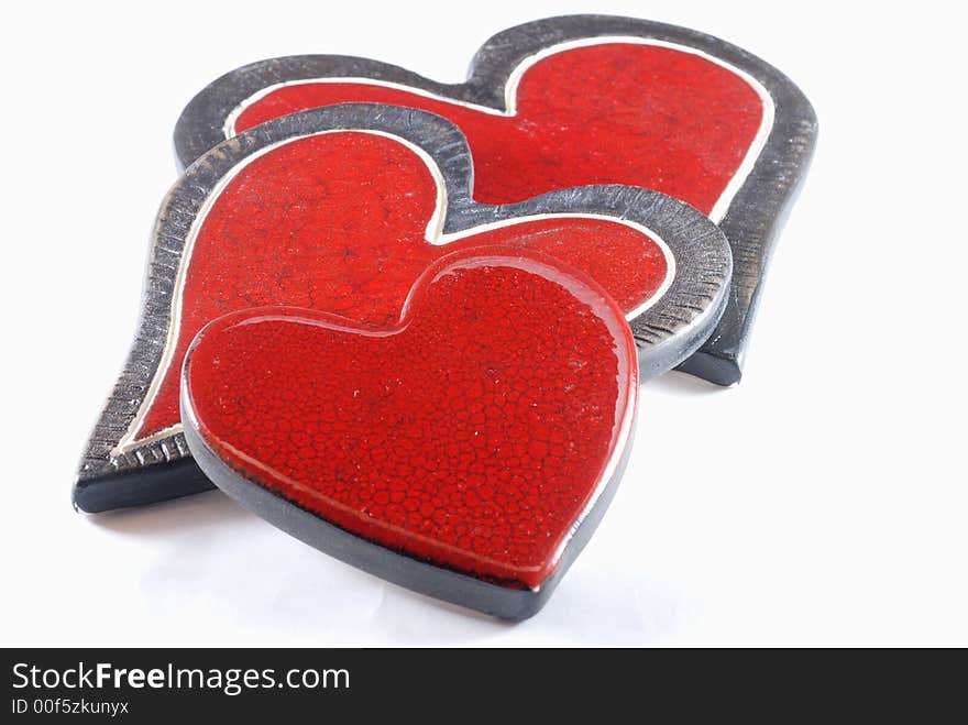 Family of three ceramic love hearts isolated on white background. Family of three ceramic love hearts isolated on white background