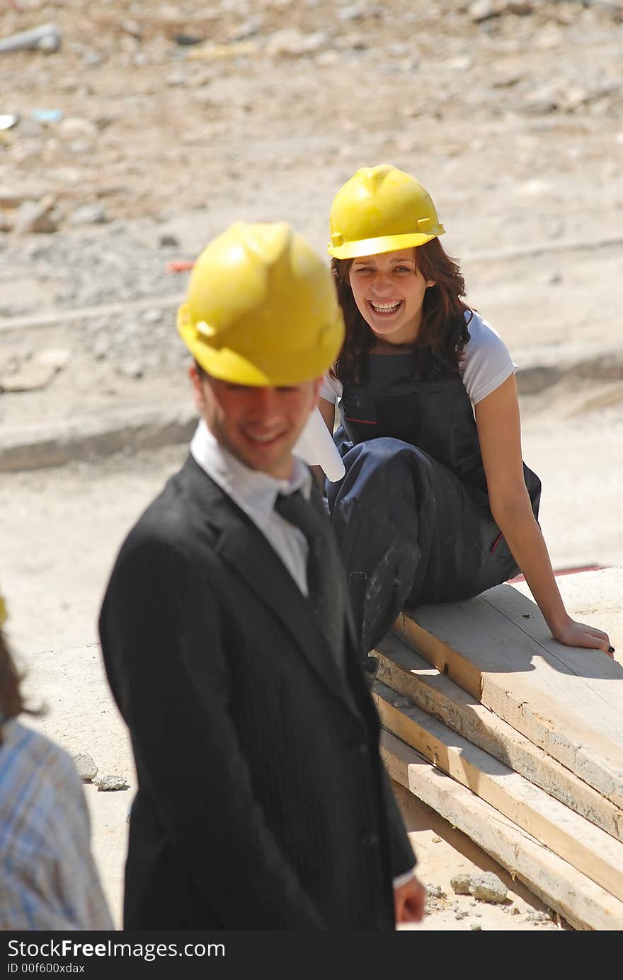 Woman and man on construction workplace. Woman and man on construction workplace