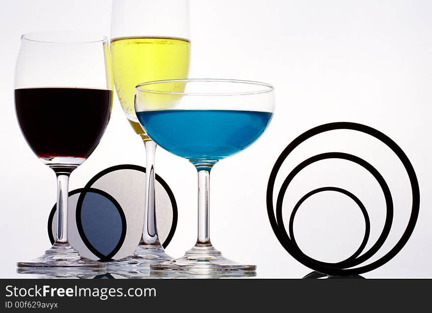 View  of three different sizes wineglasses and some figure on white sheet. View  of three different sizes wineglasses and some figure on white sheet