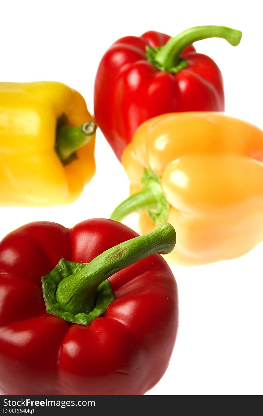 Excellent red and yellow peppers on a white background